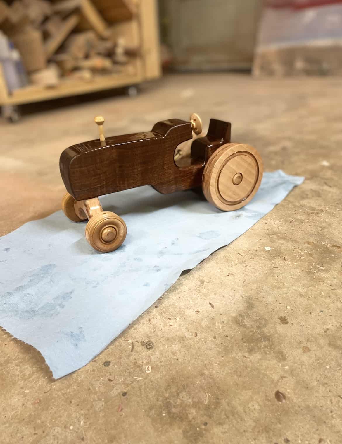 Handmade wooden toy tractor made from walnut and maple
